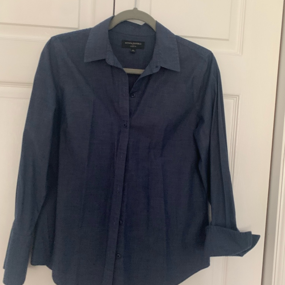 Blue button up blouse.